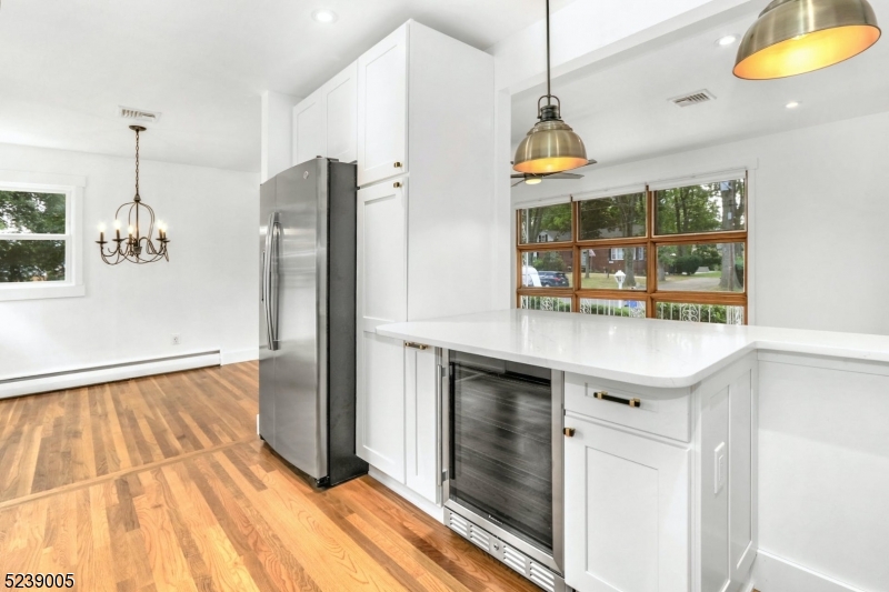 22 Morningside Road Woodbridge, NJ 07067 - Photo 17 of 27 a kitchen with stainless steel appliances granite countertop a sink and a refrigerator