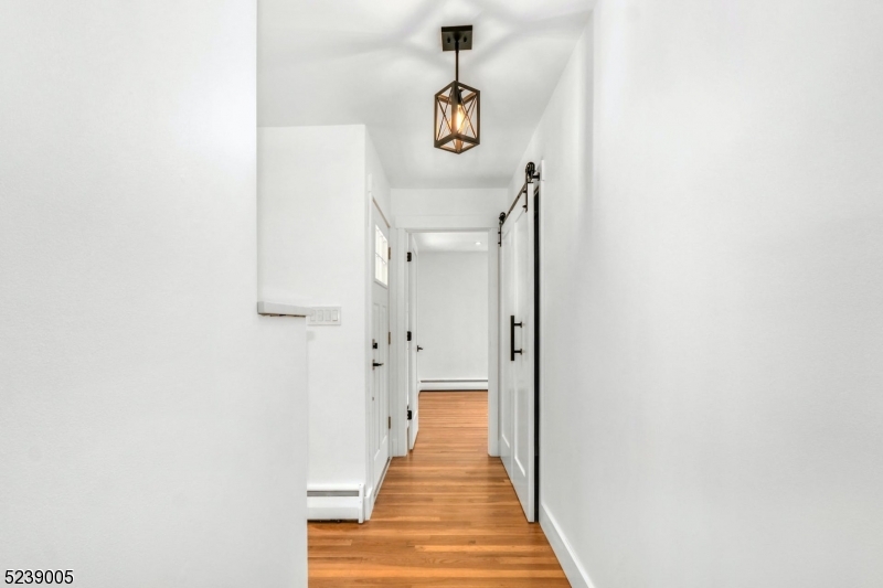 22 Morningside Road Woodbridge, NJ 07067 - Photo 18 of 27 a view of a hallway with wooden floor