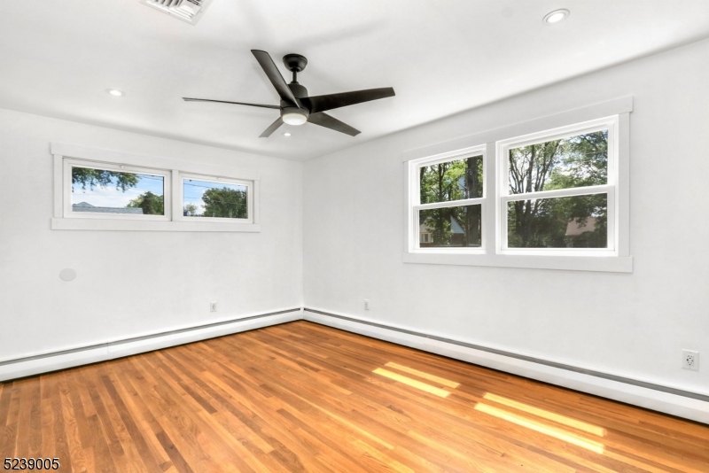 22 Morningside Road Woodbridge, NJ 07067 - Photo 20 of 27 a view of a big room with wooden floor and windows
