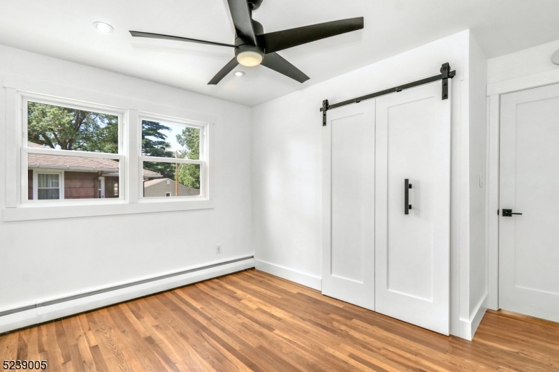 22 Morningside Road Woodbridge, NJ 07067 - Photo 24 of 27 a view of an empty room with wooden floor and a window