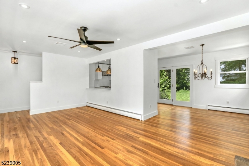22 Morningside Road Woodbridge, NJ 07067 - Photo 5 of 27 a view of empty room with wooden floor and fan