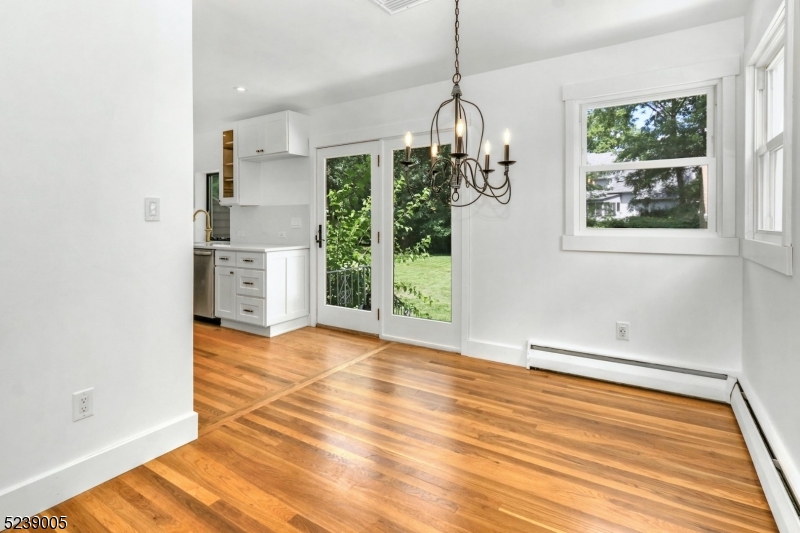 22 Morningside Road Woodbridge, NJ 07067 - Photo 7 of 27 a view of empty room with wooden floor and outdoor view