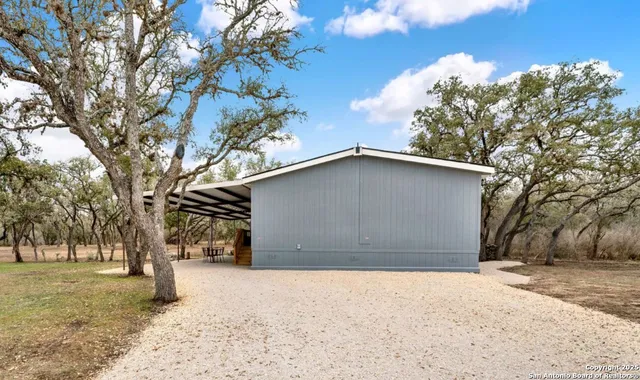 a house with trees in front of it