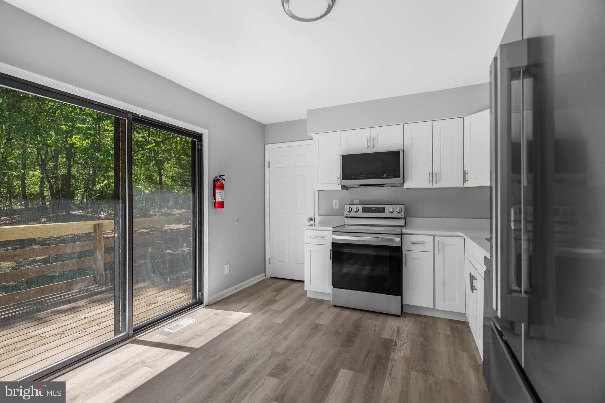 840 Jarvis Road Sicklerville, NJ 08081 - Photo 14 of 25 a kitchen with a refrigerator and a stove