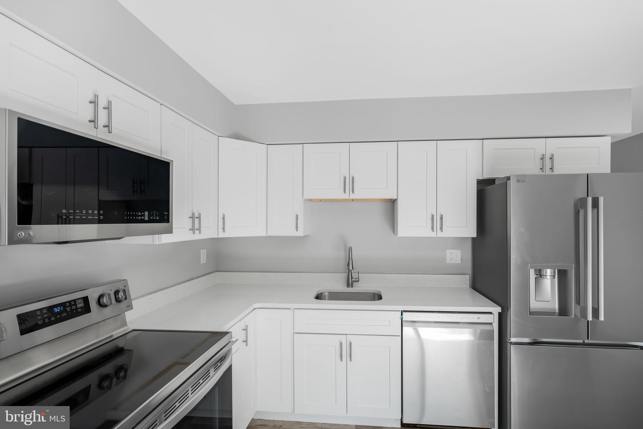 840 Jarvis Road Sicklerville, NJ 08081 - Photo 15 of 25 a kitchen with a sink stove and refrigerator