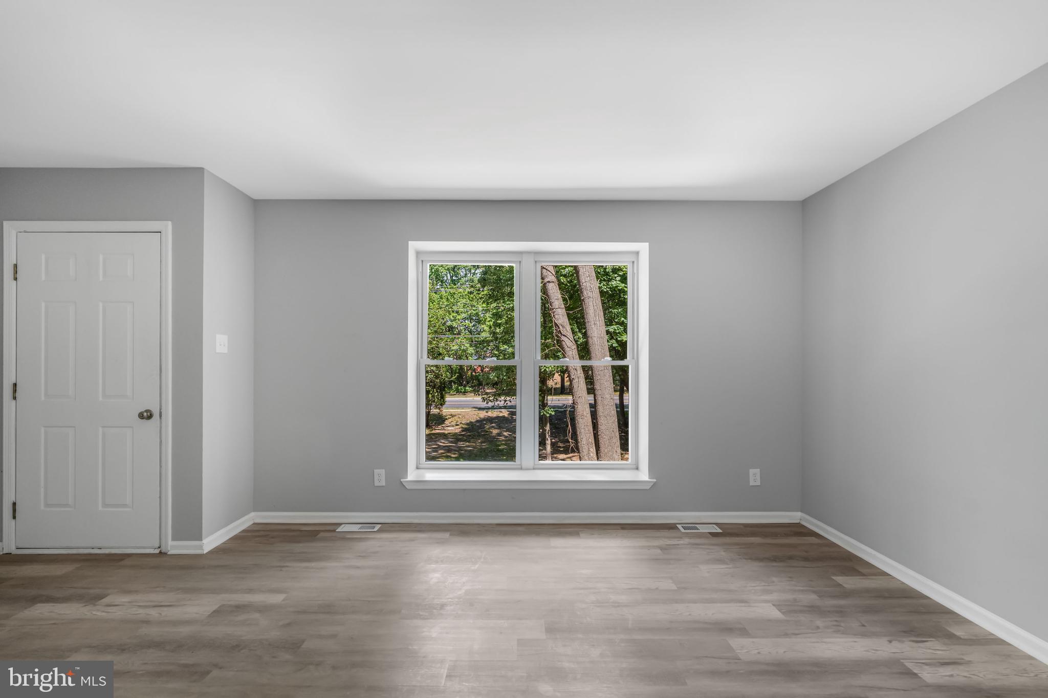 840 Jarvis Road Sicklerville, NJ 08081 - Photo 18 of 25 an empty room with wooden floor and windows