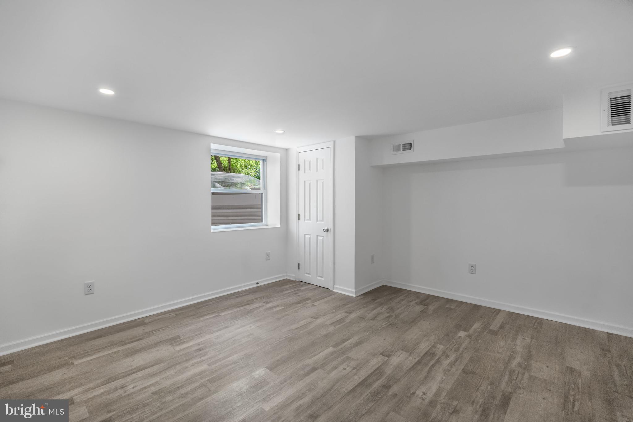 840 Jarvis Road Sicklerville, NJ 08081 - Photo 21 of 25 a view of room with wooden floor and window
