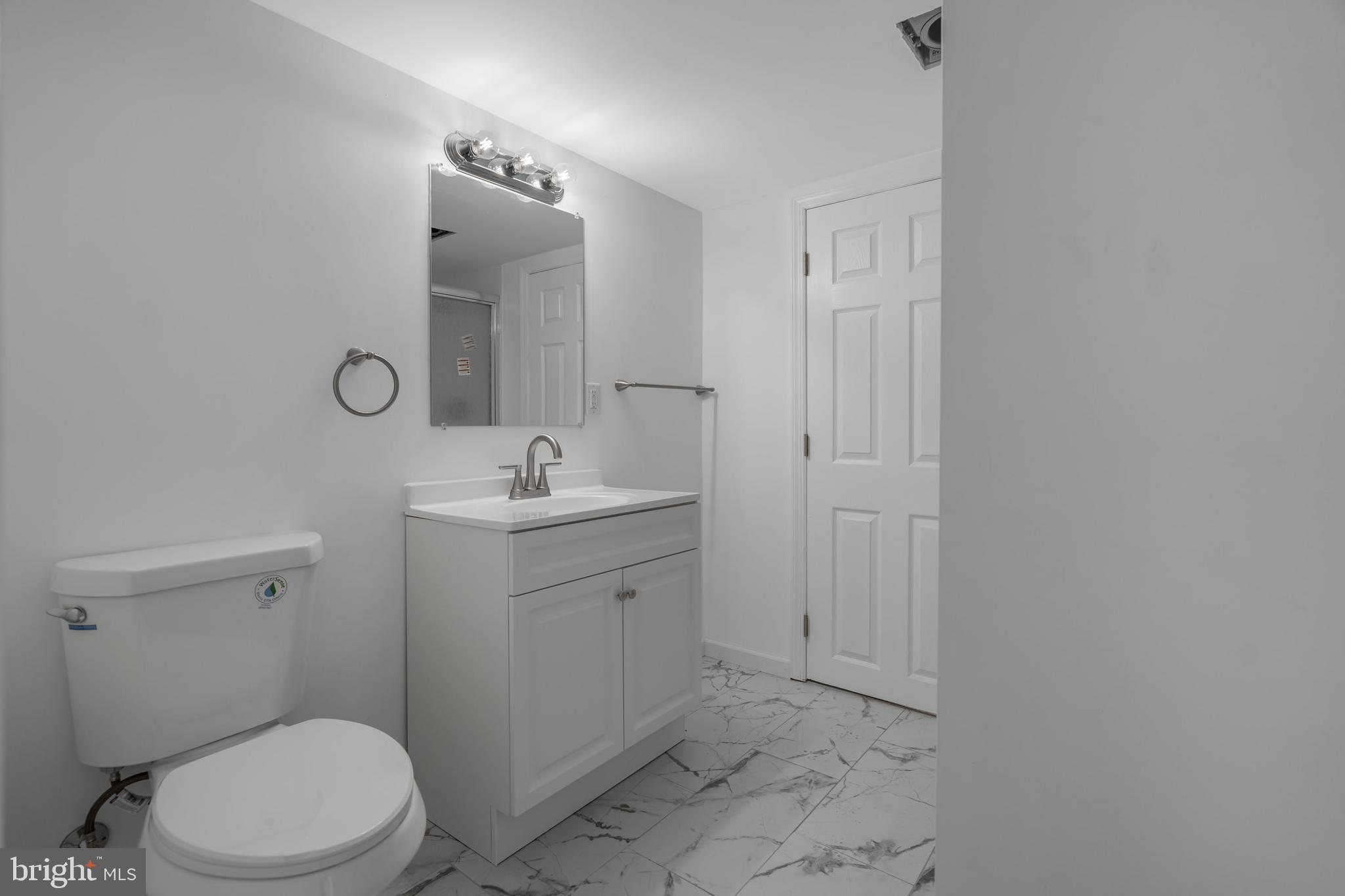 840 Jarvis Road Sicklerville, NJ 08081 - Photo 23 of 25 a bathroom with a toilet a sink a mirror and vanity