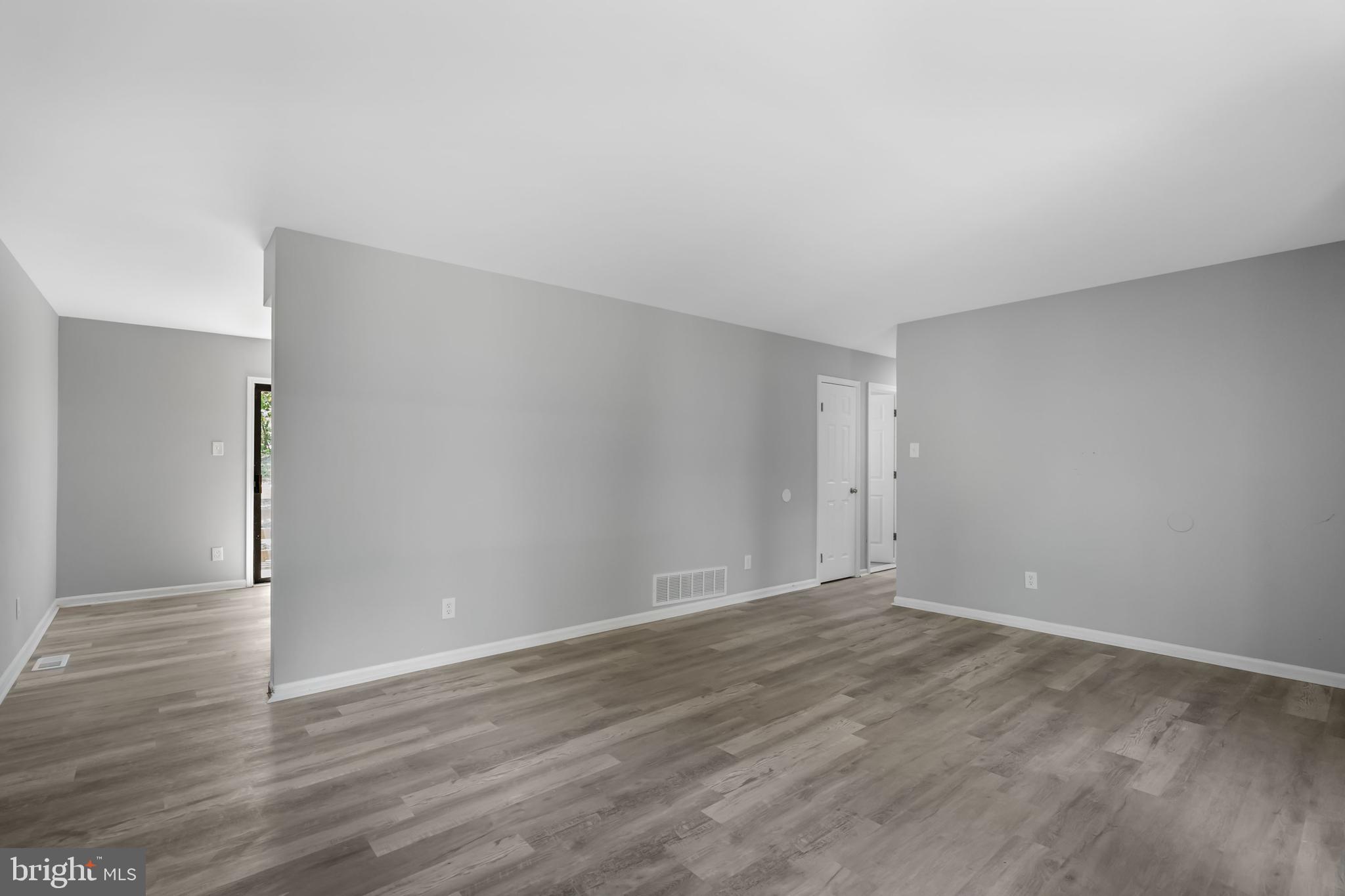 840 Jarvis Road Sicklerville, NJ 08081 - Photo 4 of 25 a view of an empty room with wooden floor
