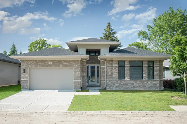 front view of a house with a garden
