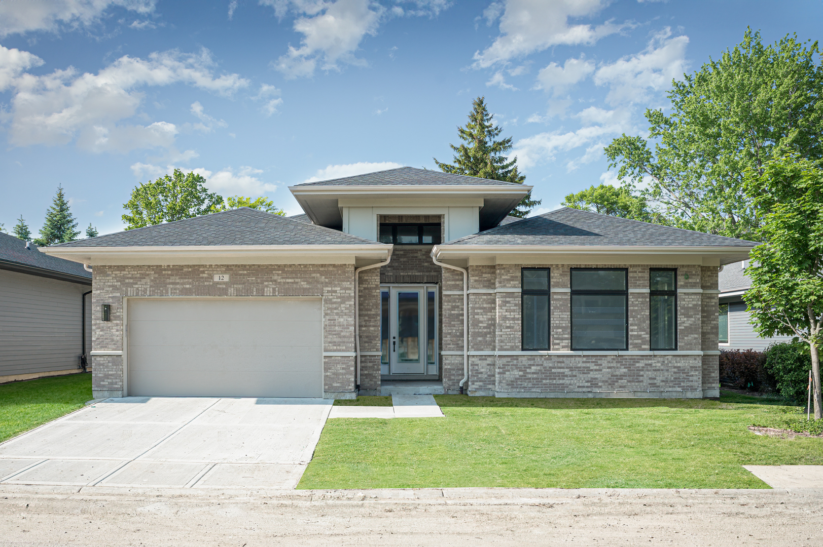 front view of a house with a garden