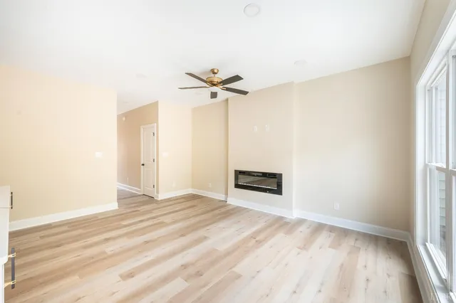 a view of a living room with wooden floor