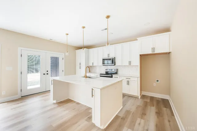 a close view of a sink and a kitchen island with a sink