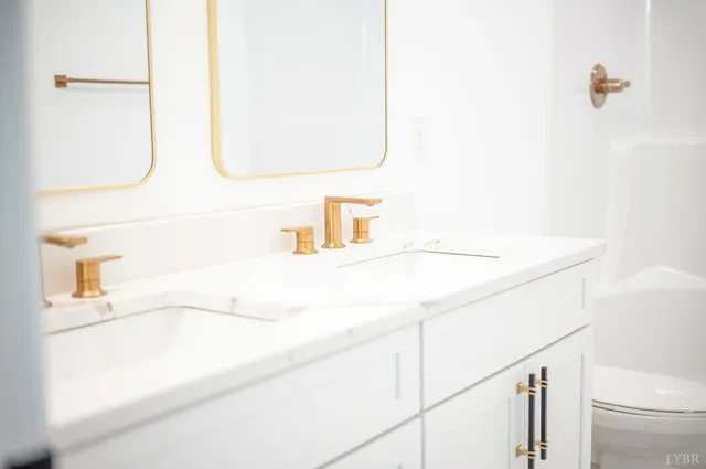 a view of a hallway with white walls and tiles