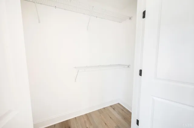 a view of a bathroom with a shower and a sink