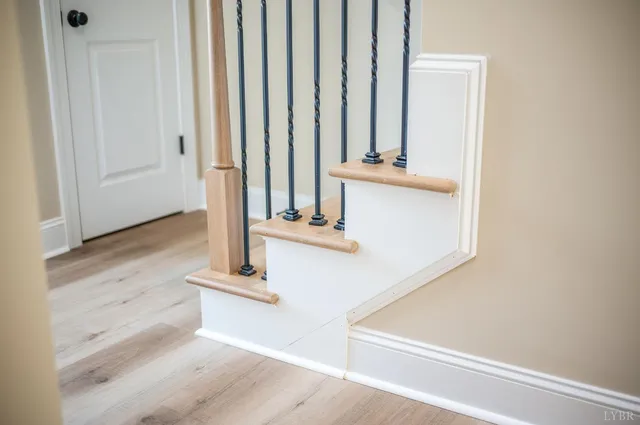 a view of a kitchen with kitchen island a counter top space a sink and appliances