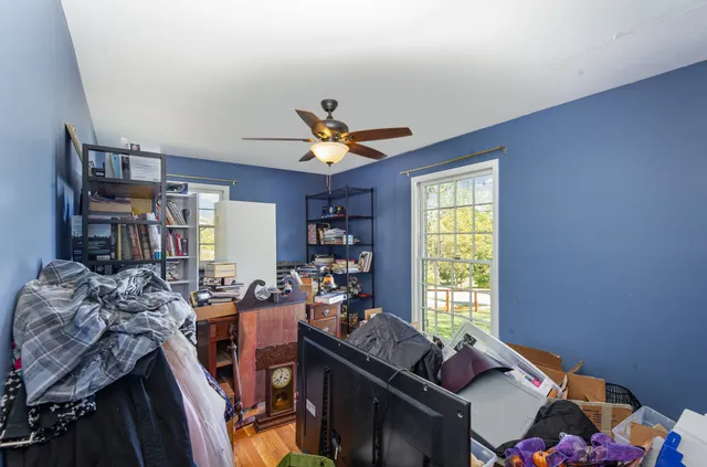 a work room with furniture and a window