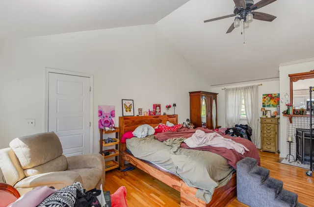 a bed room with a bed furniture and a chandelier