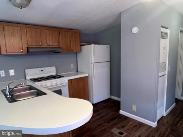 a kitchen with a appliances and cabinets