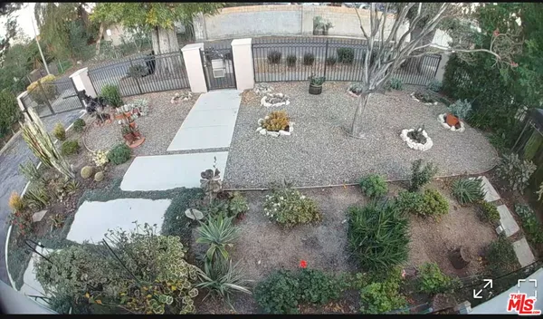 an aerial view of a house with outdoor space