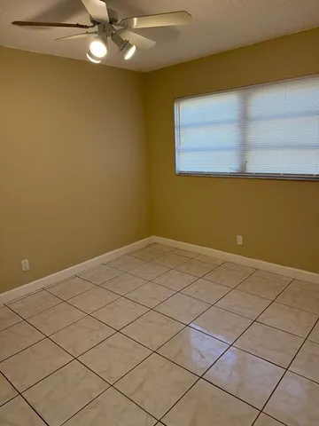a view of a small space with wooden floor