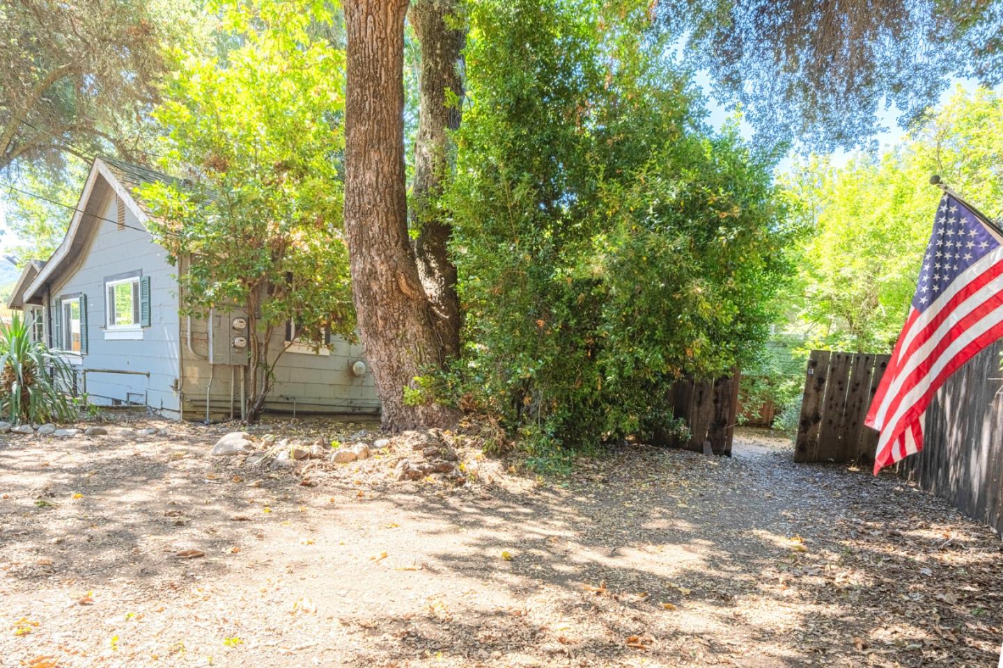 37151 Nason Road Carmel Valley, CA 93924 - Photo 12 of 22 a view of a house with a yard and tree