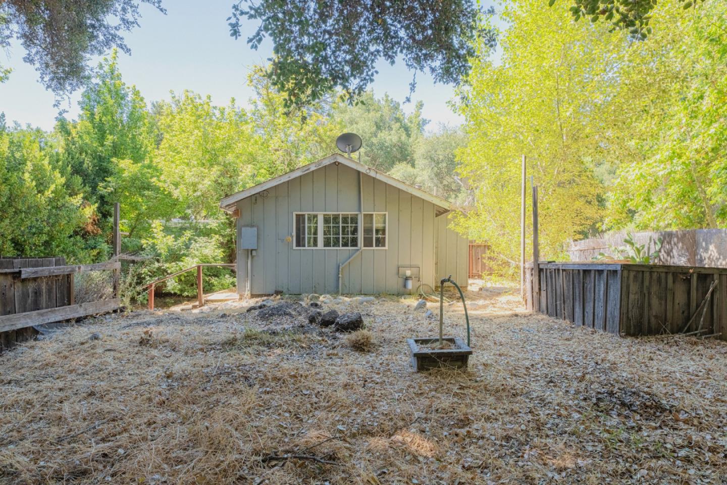 37151 Nason Road Carmel Valley, CA 93924 - Photo 13 of 22 a backyard of a house with table and chairs