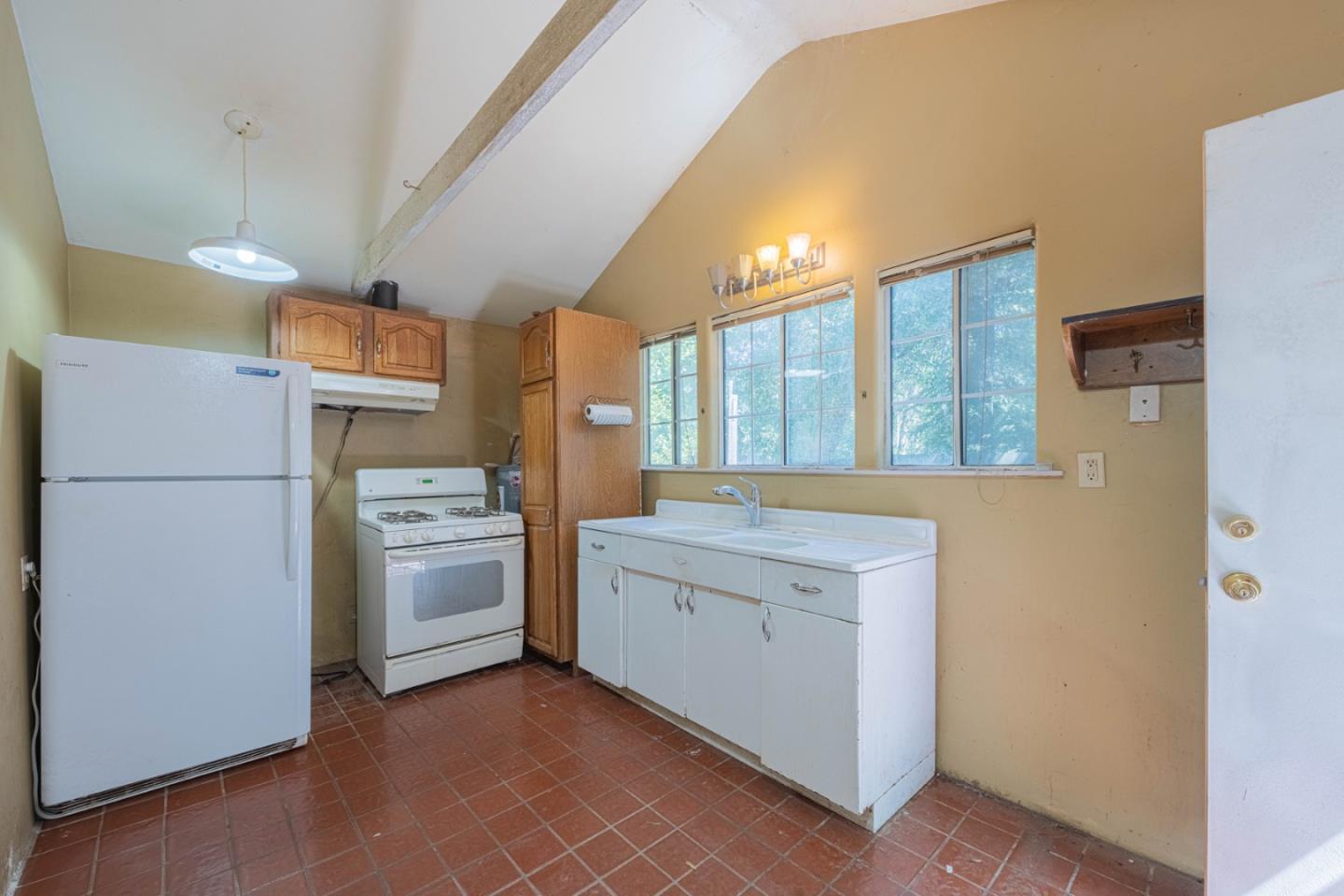 37151 Nason Road Carmel Valley, CA 93924 - Photo 14 of 22 a kitchen with a refrigerator a stove and a refrigerator
