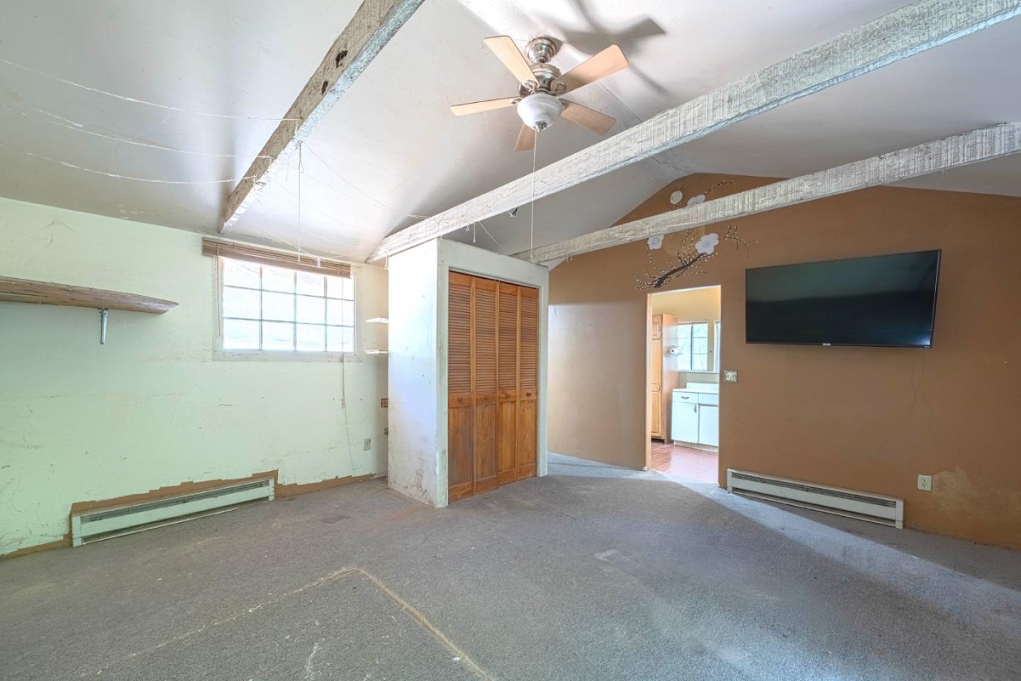 37151 Nason Road Carmel Valley, CA 93924 - Photo 15 of 22 a view of an empty room with windows