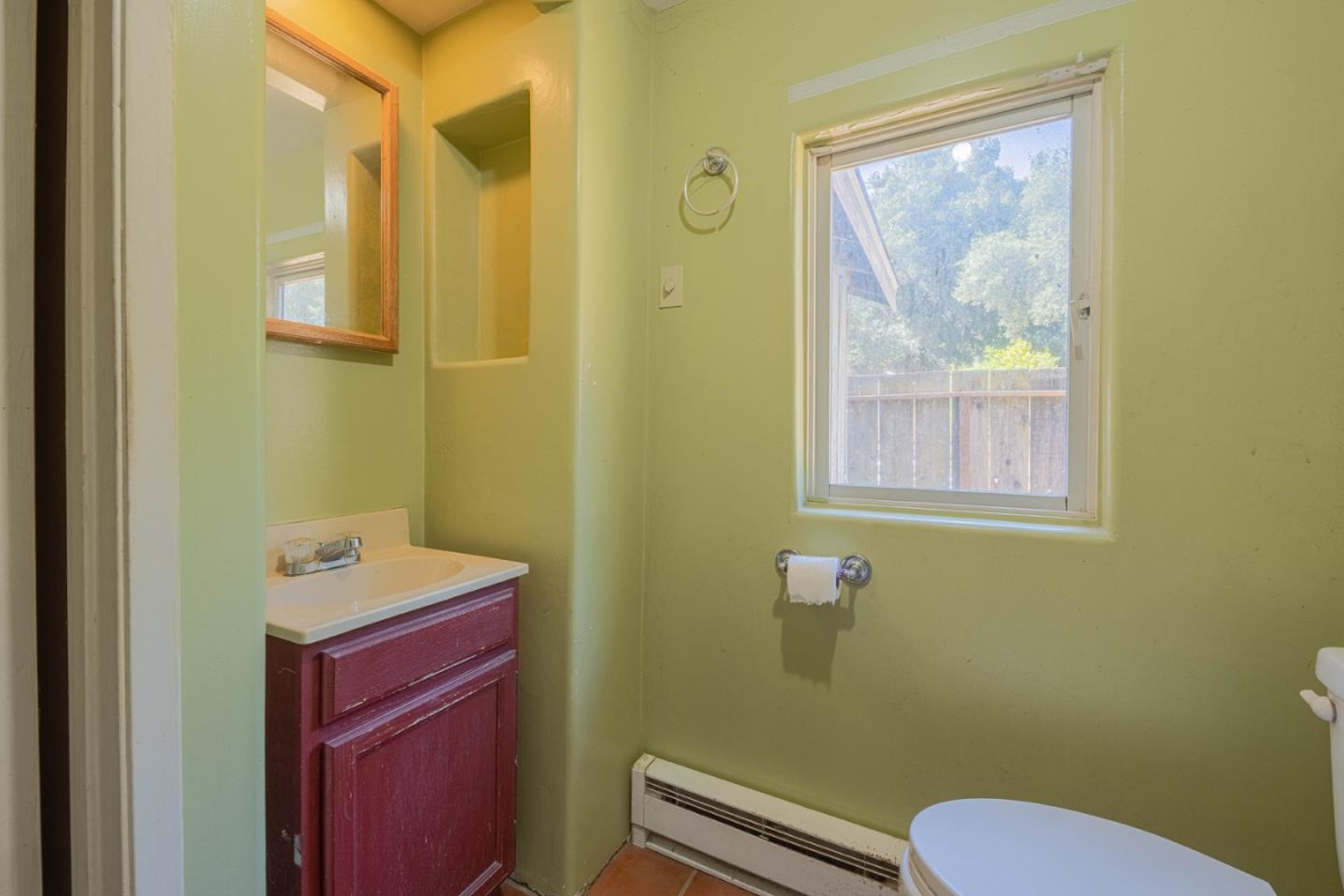 37151 Nason Road Carmel Valley, CA 93924 - Photo 16 of 22 a bathroom with a toilet a sink and mirror