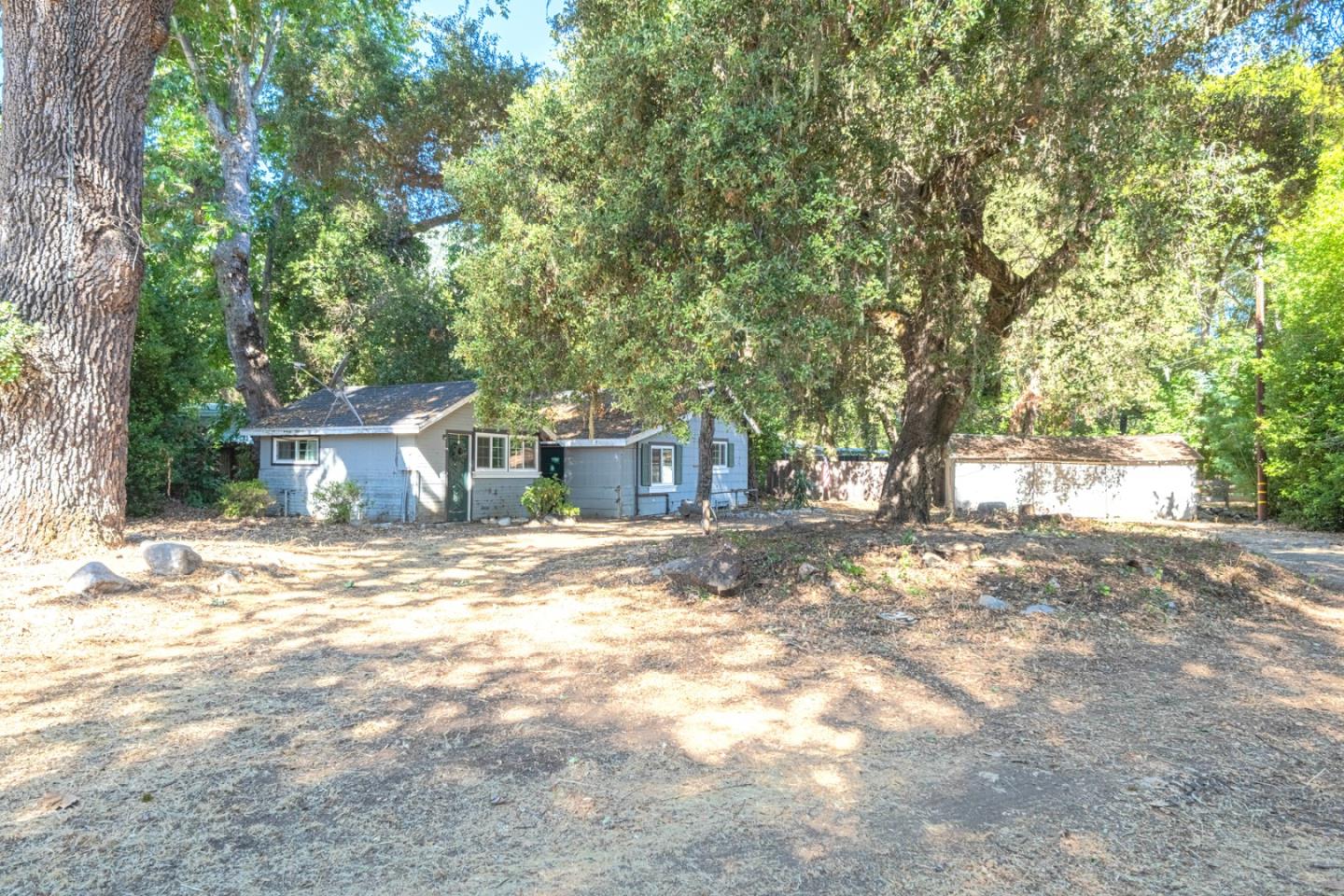 37151 Nason Road Carmel Valley, CA 93924 - Photo 20 of 22 a view of a yard with a house and large tree