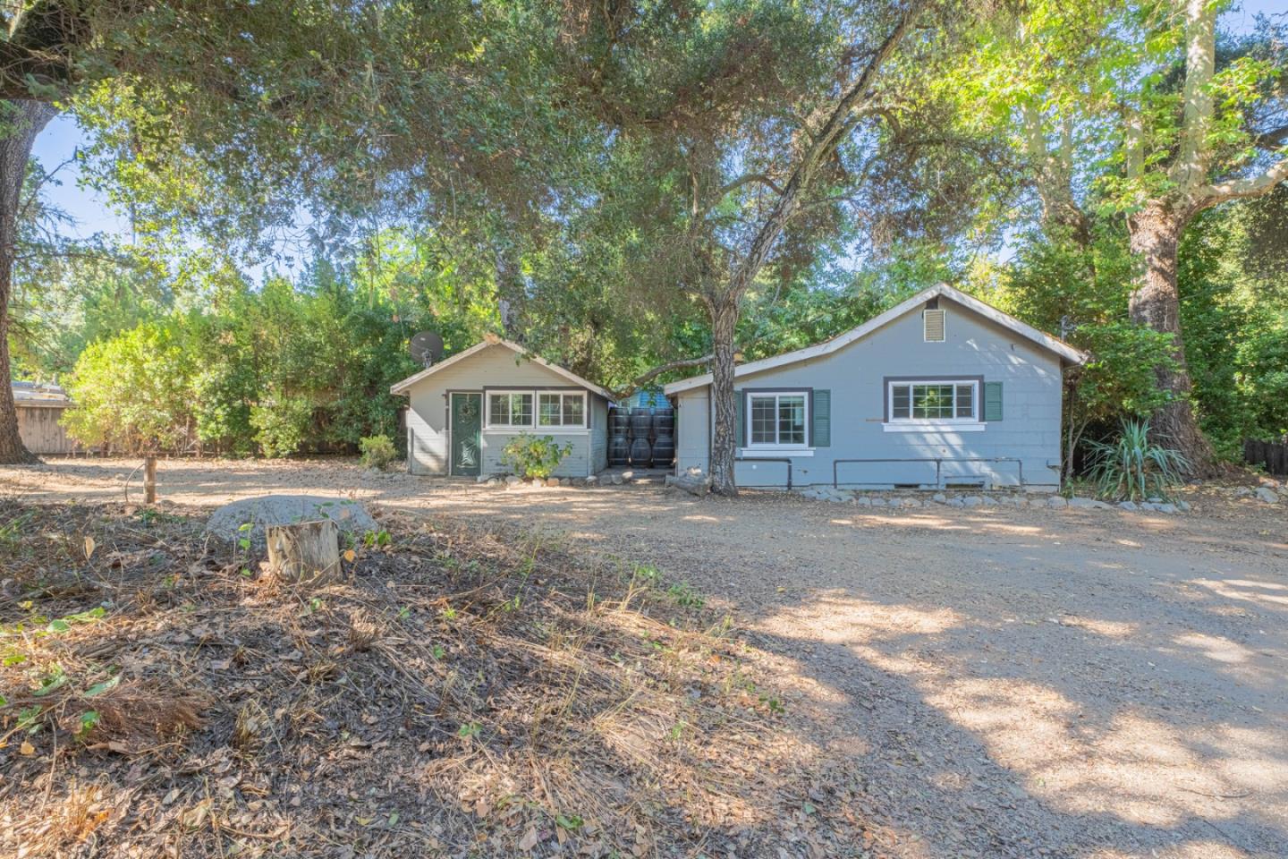 37151 Nason Road Carmel Valley, CA 93924 - Photo 2 of 22 a front view of a house with a yard and green space