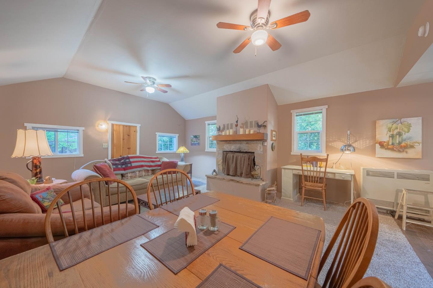 37151 Nason Road Carmel Valley, CA 93924 - Photo 5 of 22 a living room with furniture a fireplace and a chandelier
