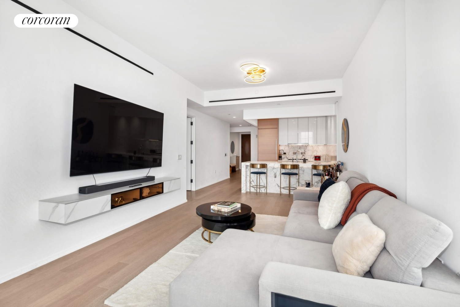 30 Riverside Boulevard, Unit 28C Manhattan, NY 10069 - Photo 3 of 10 a living room with furniture and a flat screen tv