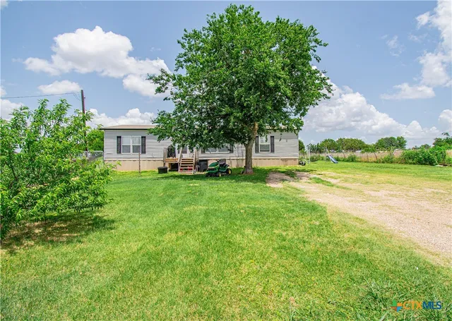 a house view with a garden space