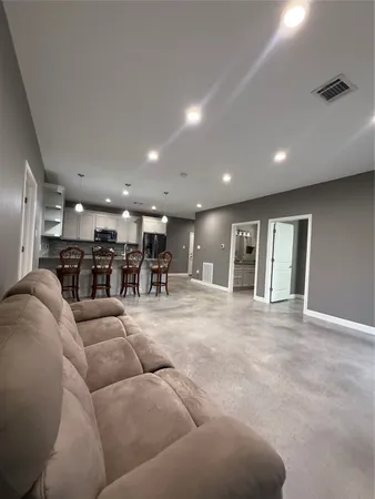 a living room with furniture and a table
