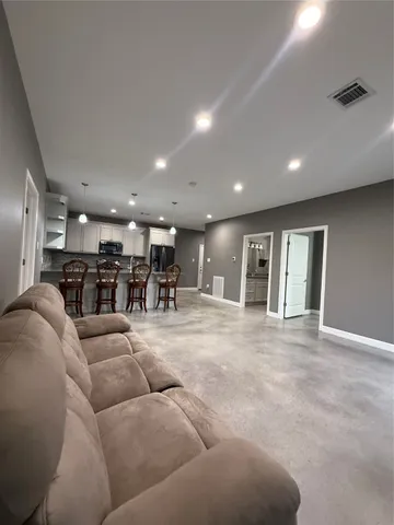 a living room with furniture and a table