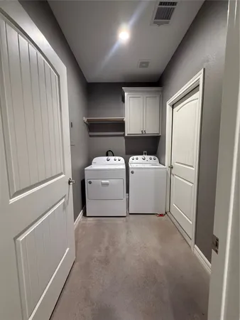 a utility room with washer and dryer