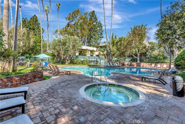 a swimming pool with outdoor seating and yard