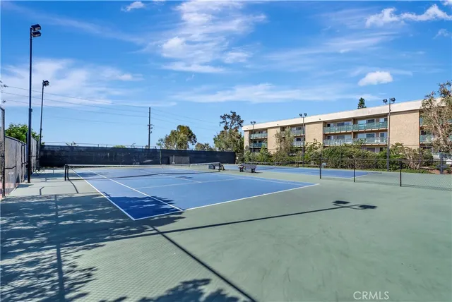 a living room with furniture a fireplace and a large window