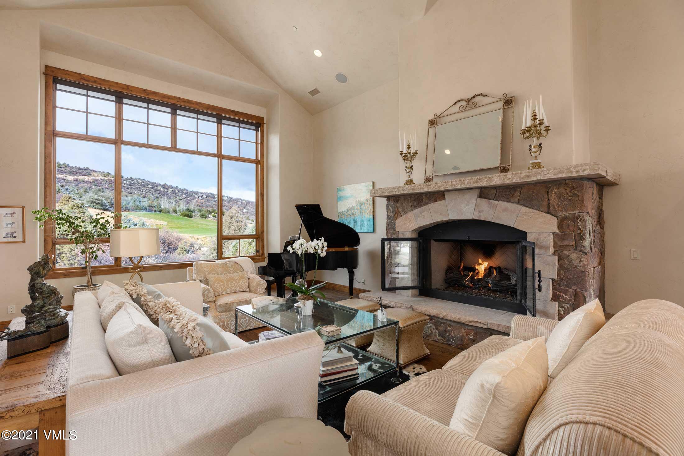 109 Juniper Trail Wolcott, CO 81655 - Photo 2 of 9 a living room with furniture large window and a fireplace
