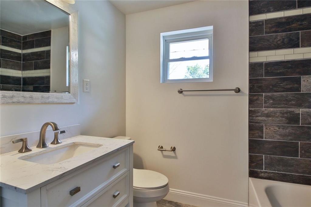 938 Bebout Road Venetia, PA 15367 - Photo 14 of 20 Fully renovated hallway bathroom with granite top vanity and tile shower