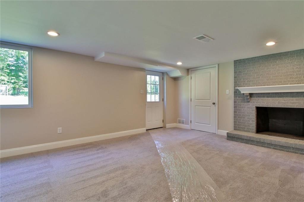 938 Bebout Road Venetia, PA 15367 - Photo 15 of 20 The large, fully renovated, basement is the perfect place for the kids to play or to set up your media room. It is detailed with recessed lights, new carpets, brick accented wood burning fireplace, and provides access to the rear yard, garage, utility room, bathroom, and laundry room.