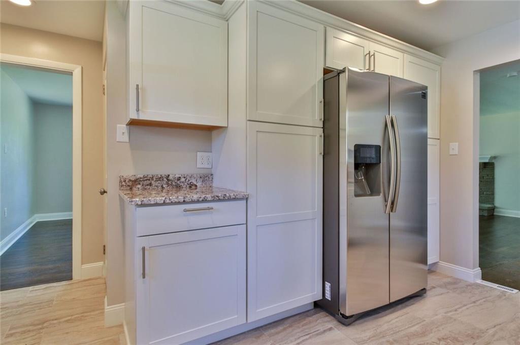 938 Bebout Road Venetia, PA 15367 - Photo 5 of 20 Beautifully designed kitchen with brand new hardwood cabinets, granite counter-tops and back-splash, stainless steel appliances, recessed lighting, and designer tile flooring.