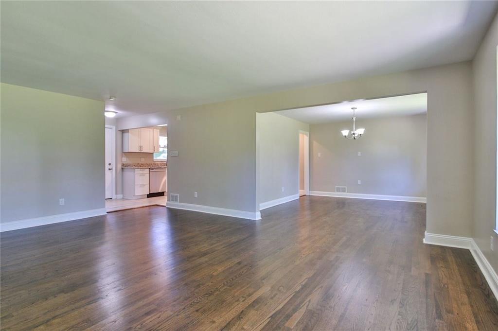 938 Bebout Road Venetia, PA 15367 - Photo 8 of 20 The living room flows into a large dinning room that is also accessible through the kitchen. Perfect for dinner parties and entertaining guests.