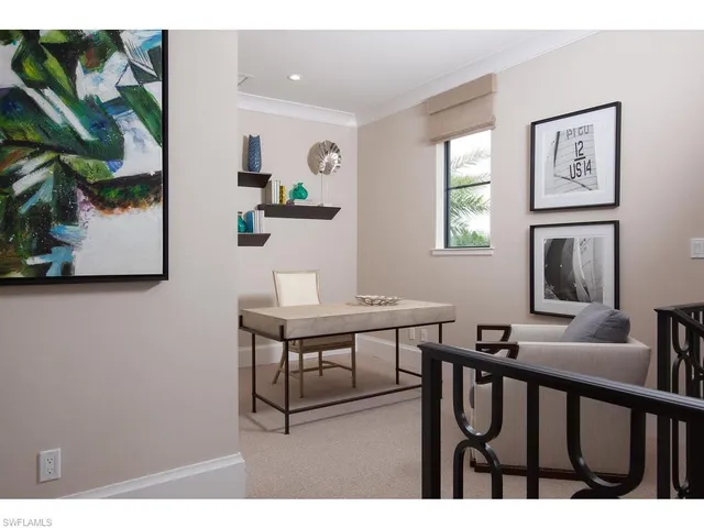 a view of a livingroom with furniture and window