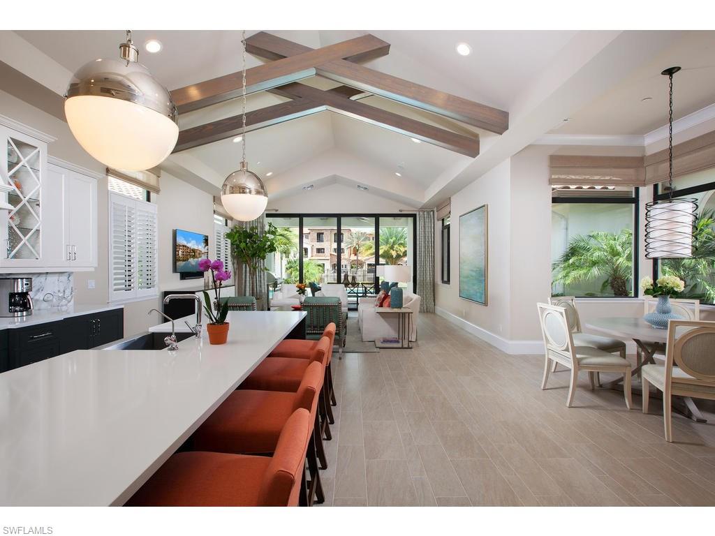 16476 Talis Park Drive Naples, FL 34110 - Photo 5 of 16 a room with furniture and a large window