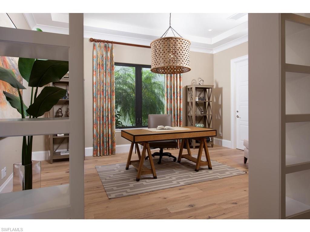 16476 Talis Park Drive Naples, FL 34110 - Photo 8 of 16 a view of a livingroom with furniture window and wooden floor