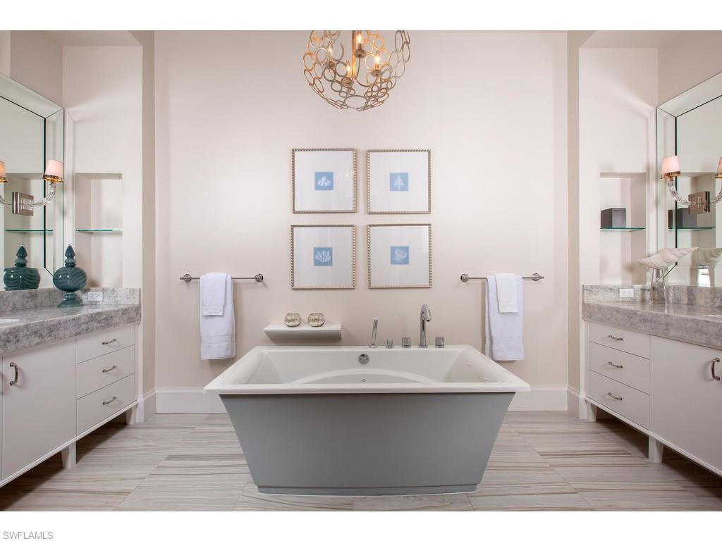 16476 Talis Park Drive Naples, FL 34110 - Photo 10 of 16 a bathroom with a sink mirror and a toilet