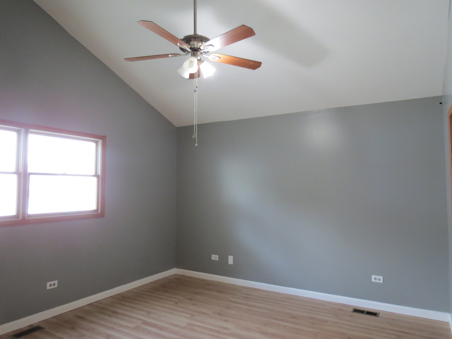 274 East 34th Street Steger, IL 60475 - Photo 15 of 26 an empty room with wooden floor and windows
